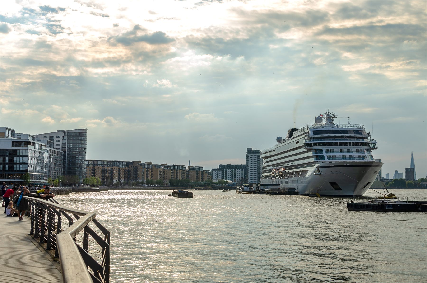 An ocean cruise ship moored on the River Thames in London, with the Shard on the skyline